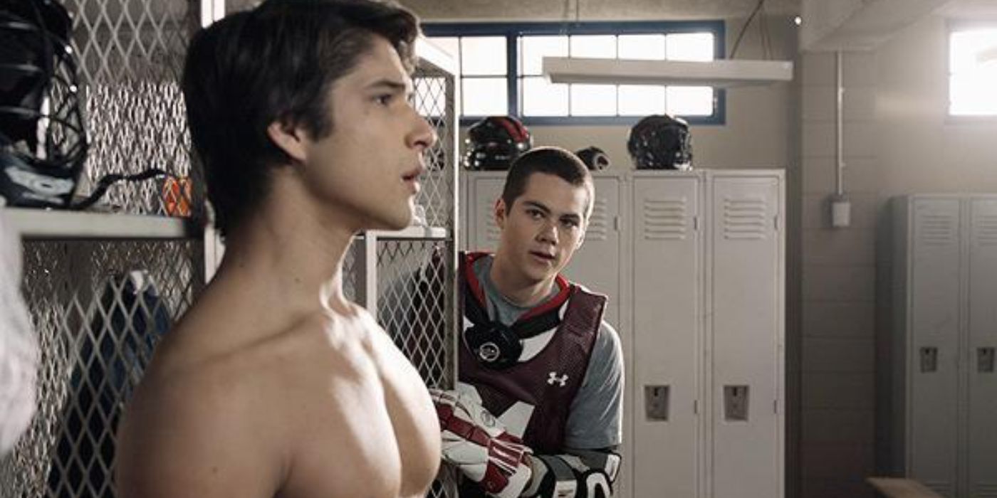 Dylan O'Brien approaching Tyler Posey in the locker room in Teen Wolf