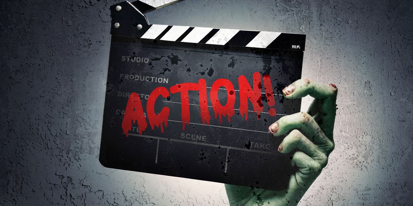 A zombie hand holding a clapperboard with the word ACTION written in red letters.