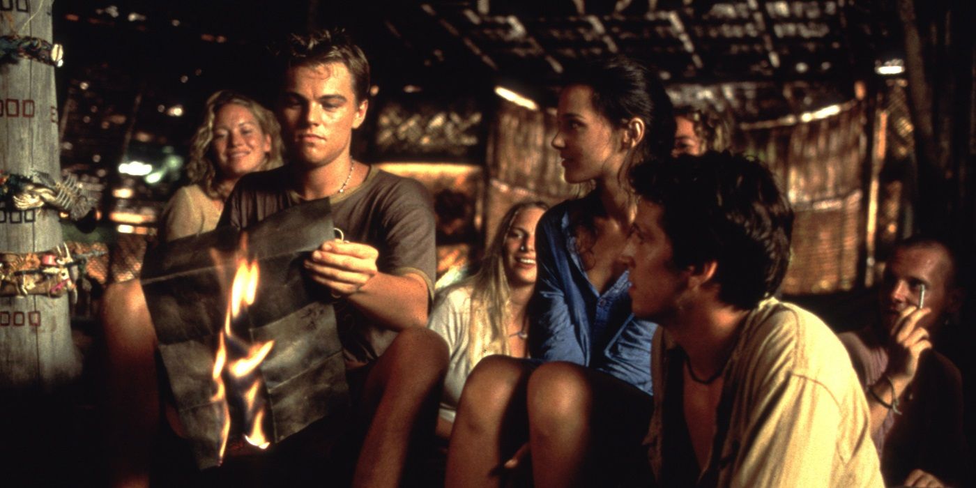 Leonardo DiCaprio, Virginie Ledoyen, and Guillaume Canet burning a map in The Beach (2000)
