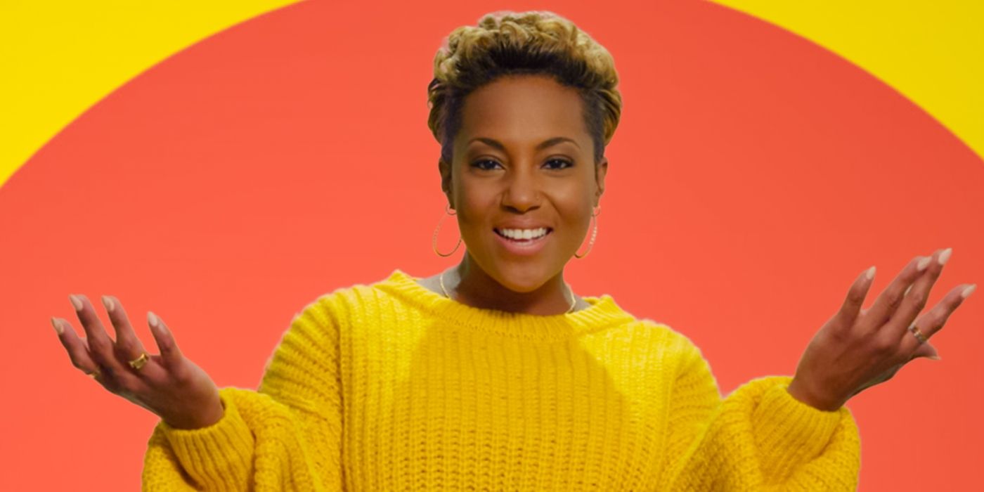 The Circle Season 6 contestant Caress stands in a yellow sweater.