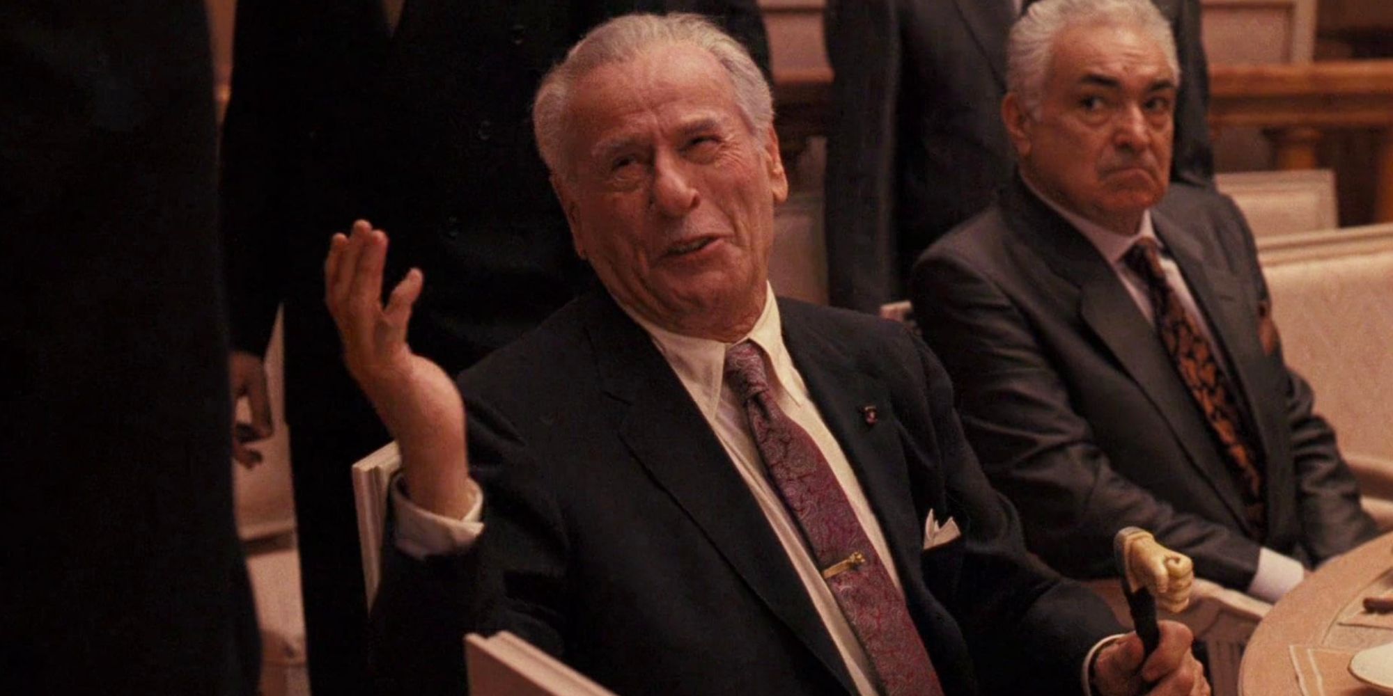 Don Altobello smiling while talking to someone in The Godfather_ Part III - 1990