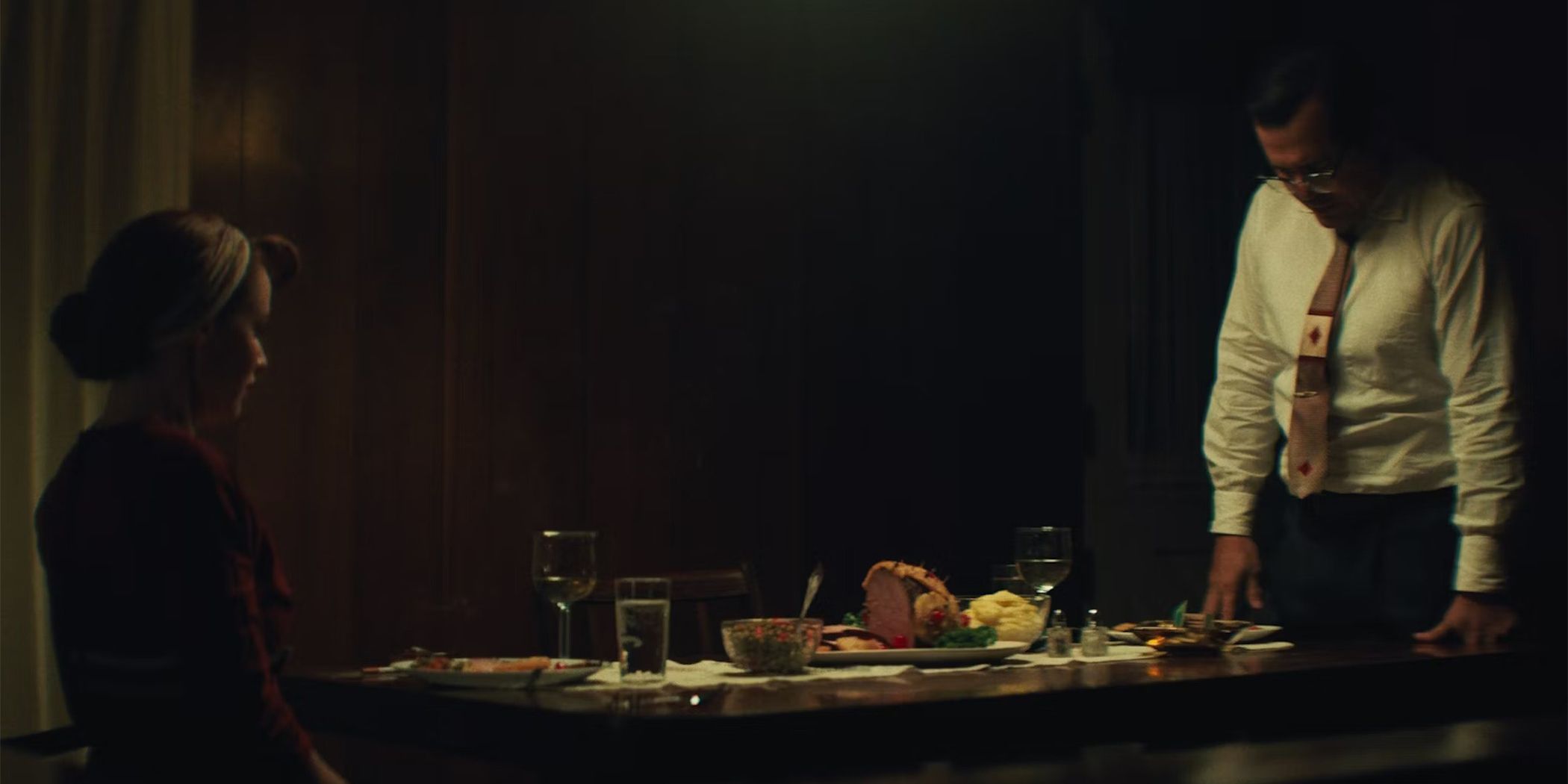 Hani Furstenberg and John Leguizamo having a tense moment at the dinner table in The Green Veil