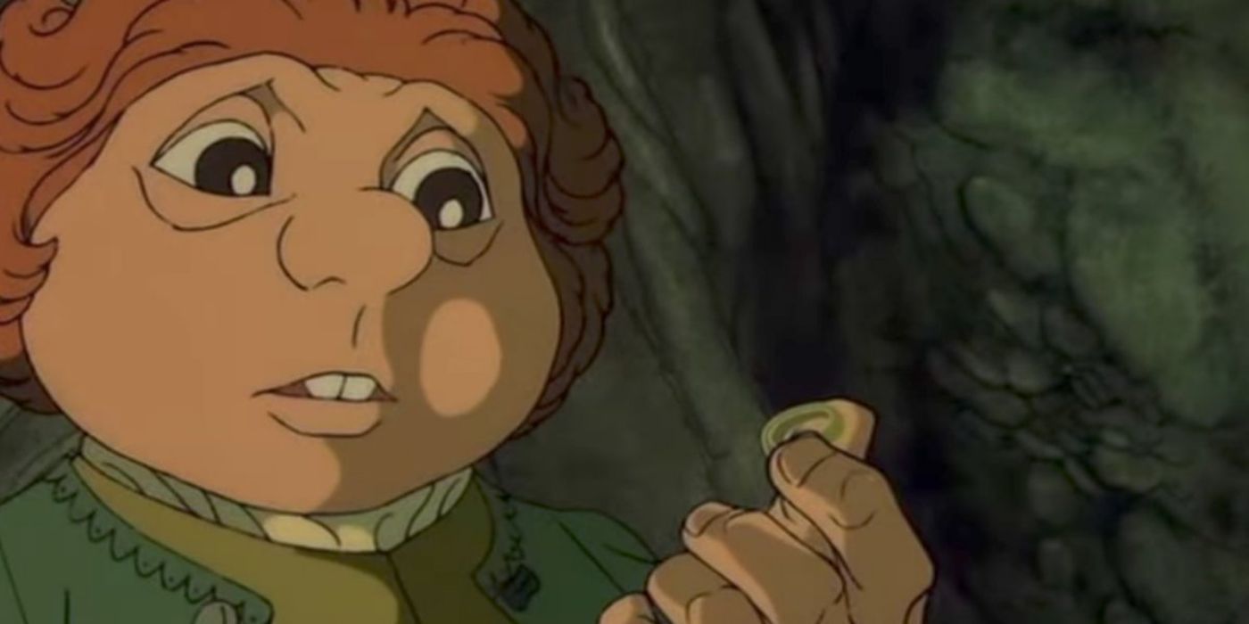 Bilbo Baggins holds the One Ring in his hand in 1977's The Hobbit