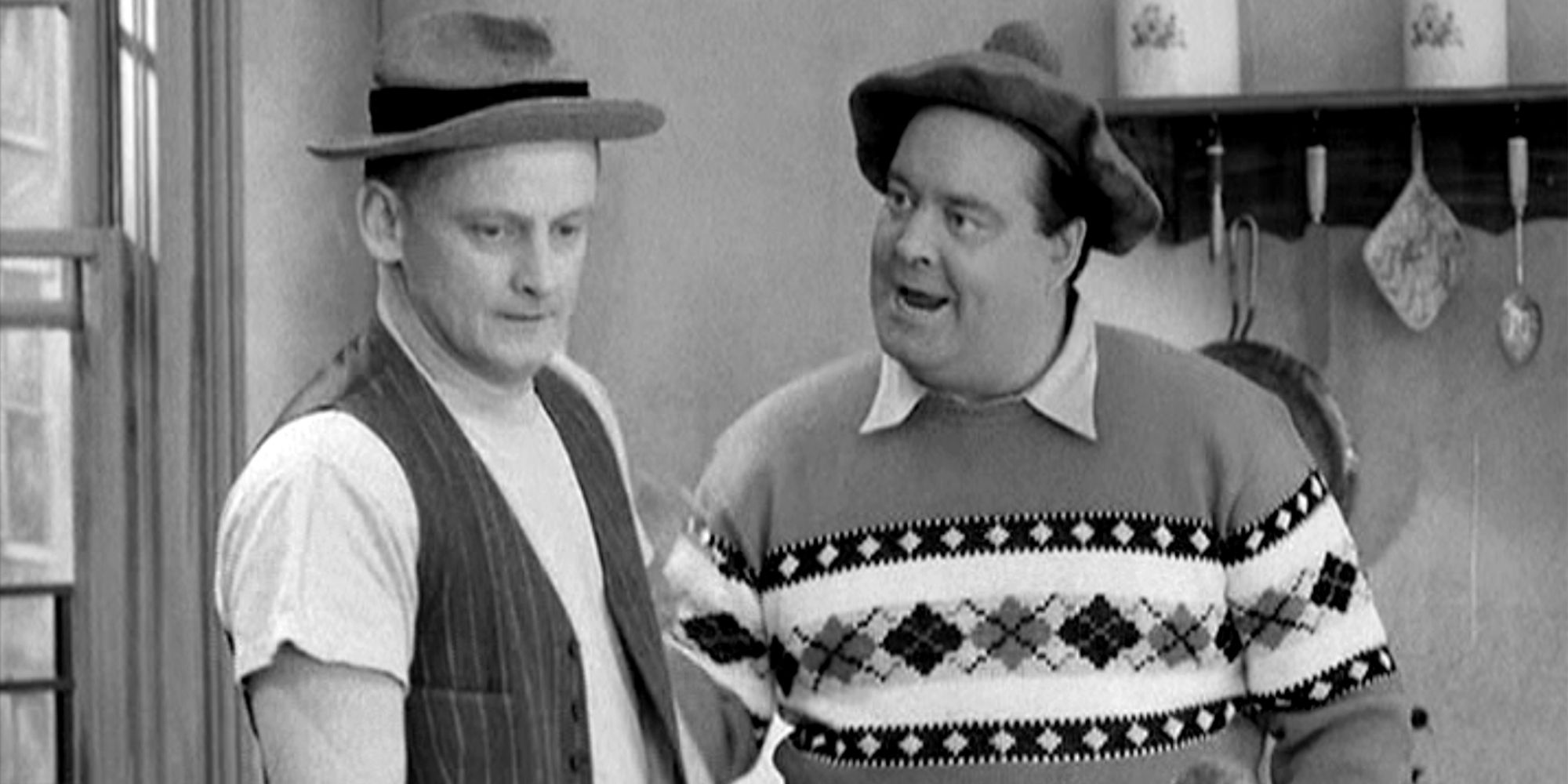 Jackie Gleason as Ralph Kramden and Art Carney as Ed Norton in 'The Honeymooners'ers'