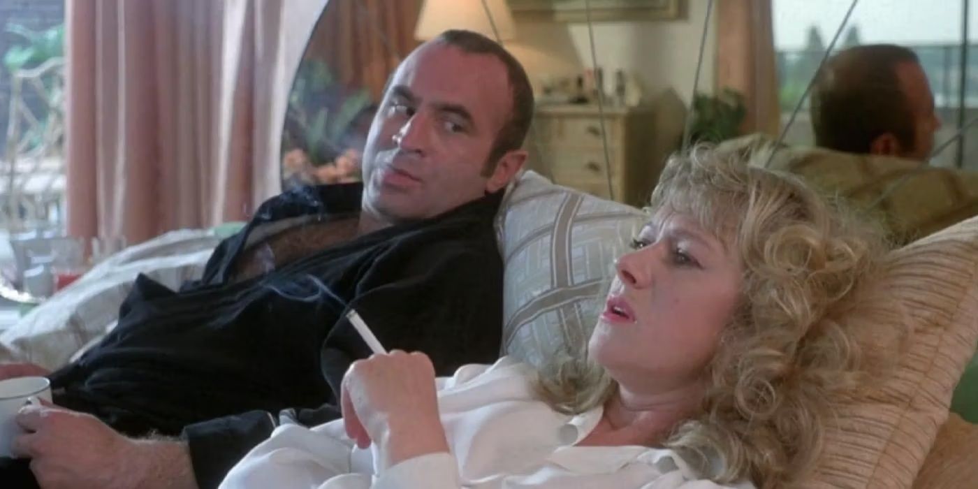 Bob Hoskins as Harold looking at Helen Mirren as Victoria while lying in bed together in The Long Good Friday