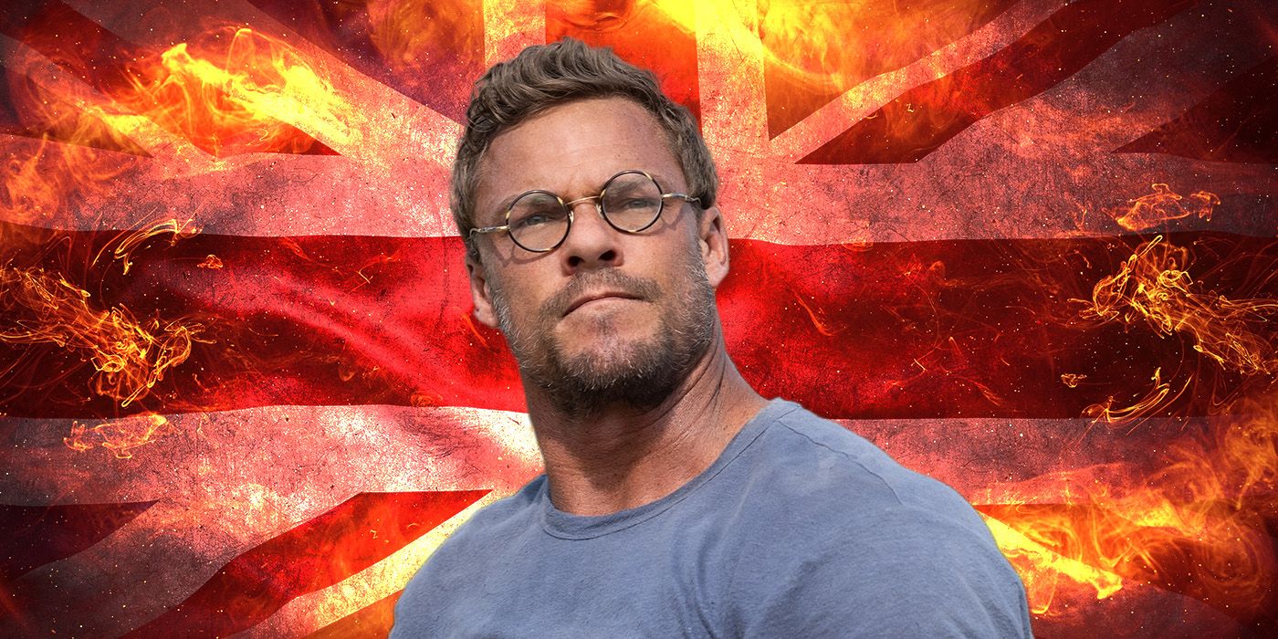 Alan Ritchson from The Ministry of Ungentlemanly Warfare in front of a burning union jack flag