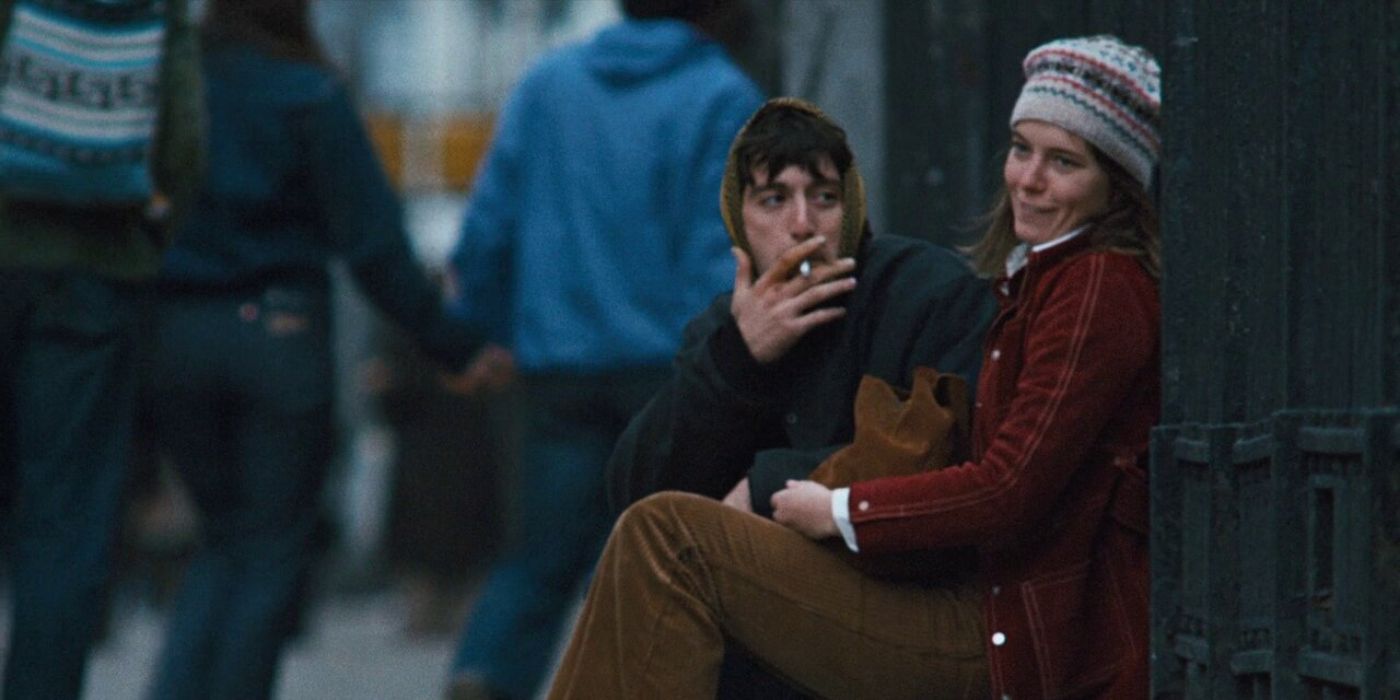 Al Pacino as Bobby smokes and Kitty Winn as Joan sit in the street together  in a in &lsquo;The Panic In Needle Park