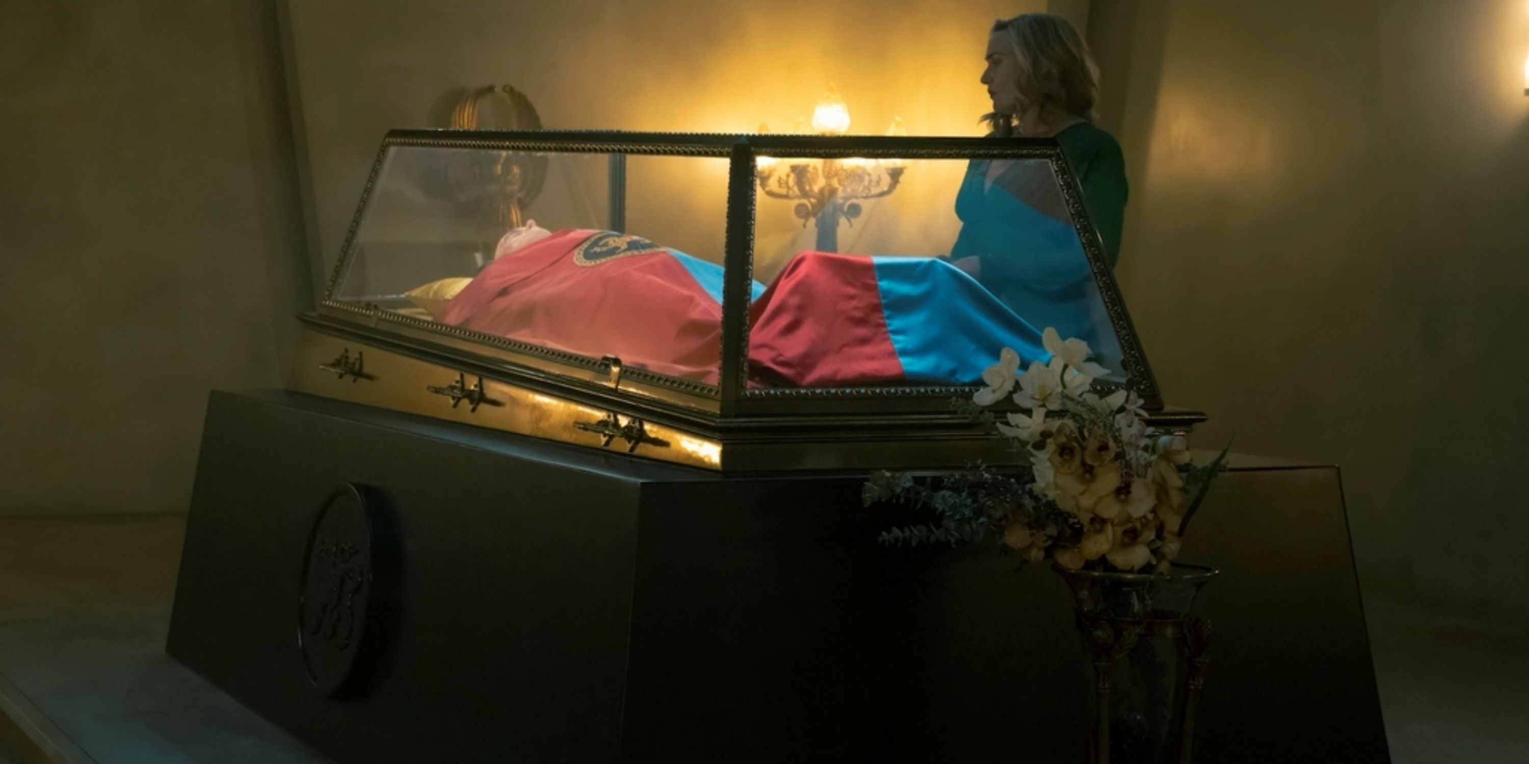 Kate Winslet as Chancellor Elena Vernham talking to a corpse in Season 1 of The Regime