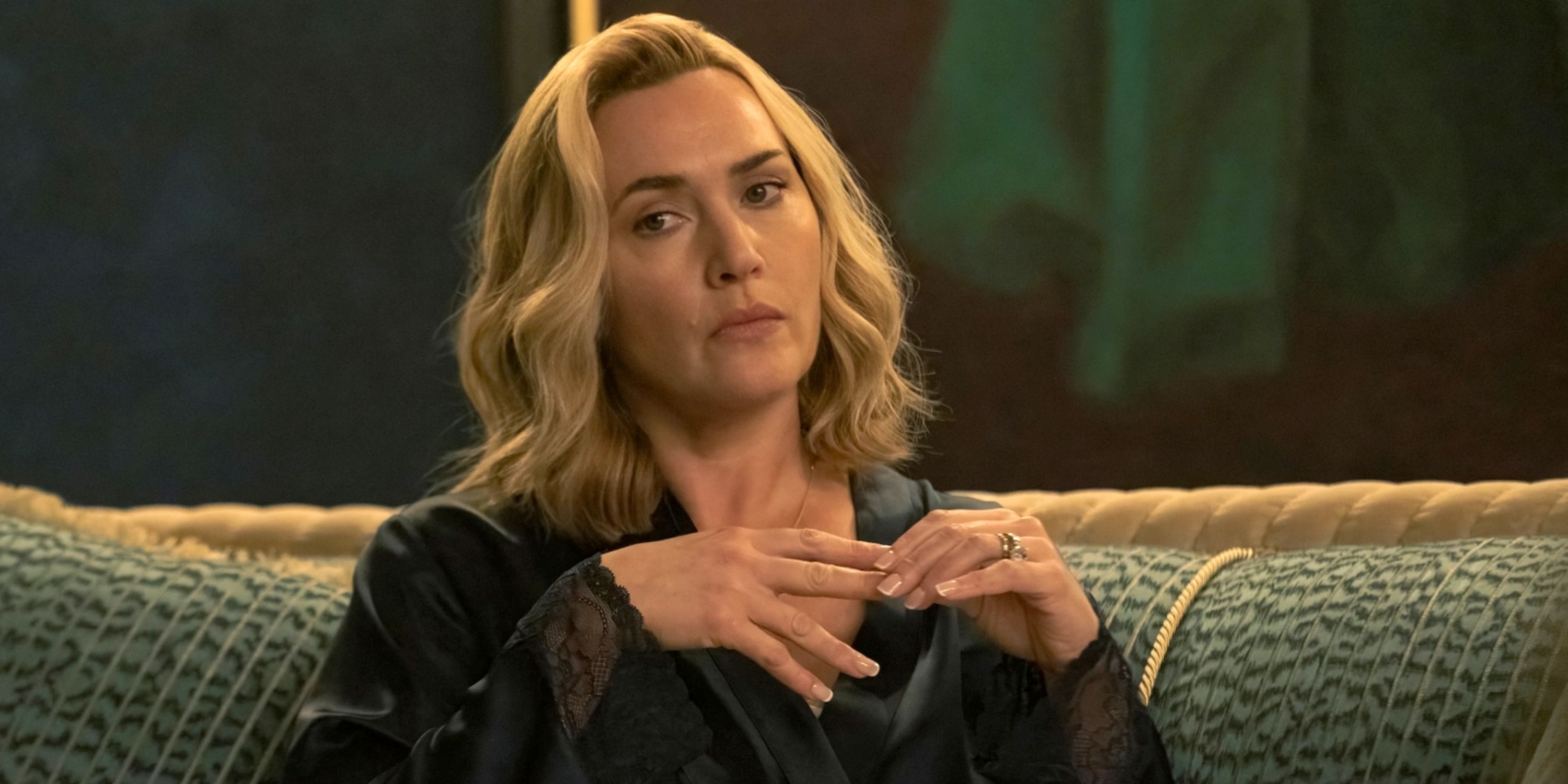 Kate Winslet as Chancellor Elena Vernham holding two fingers in Episode 2 of The Regime