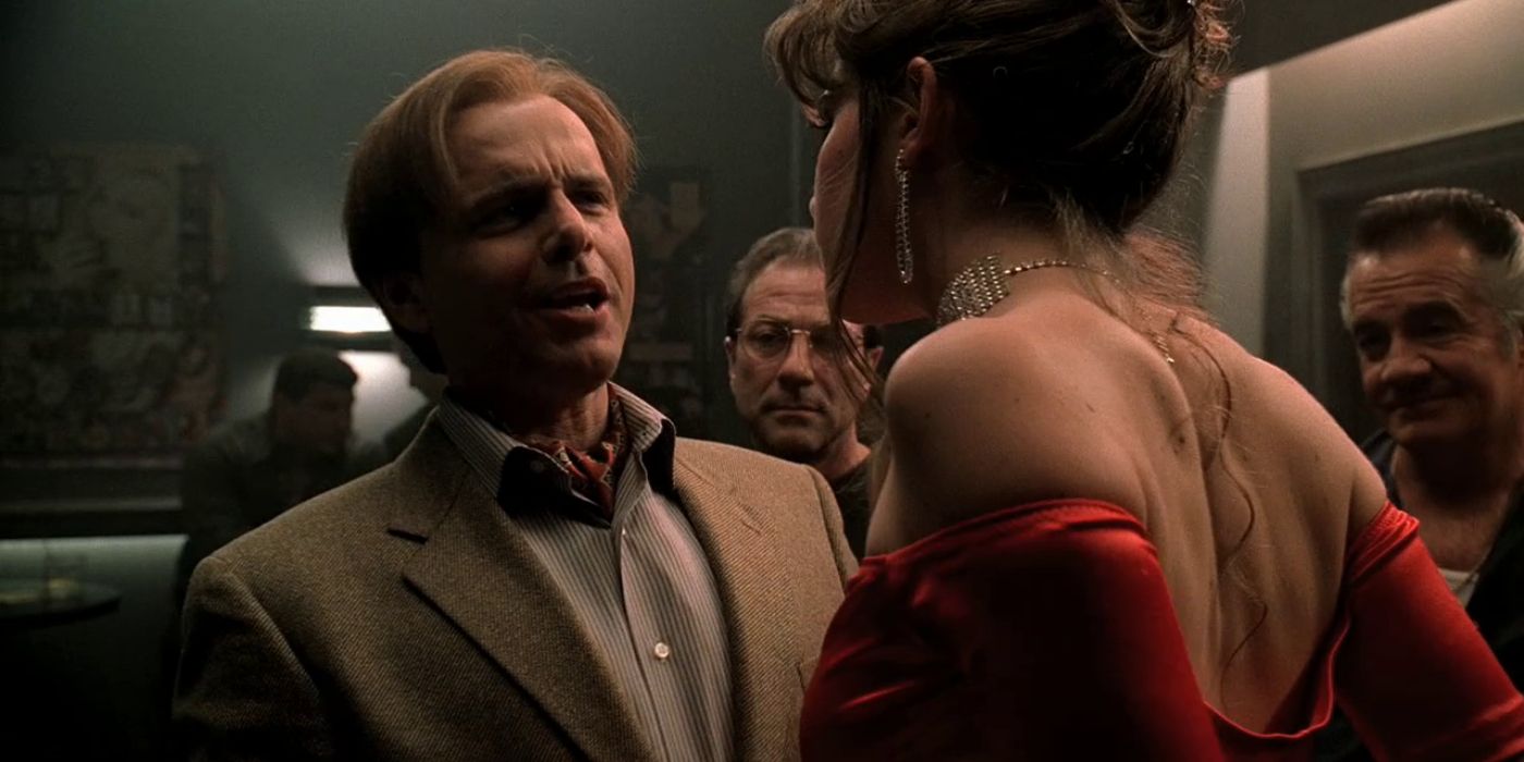 Ralphie Cifaretto (Joe Pantoliano) is confronting by a stripper in the Bada Bing as he stands with fellow mobsters in 'The Sopranos'.