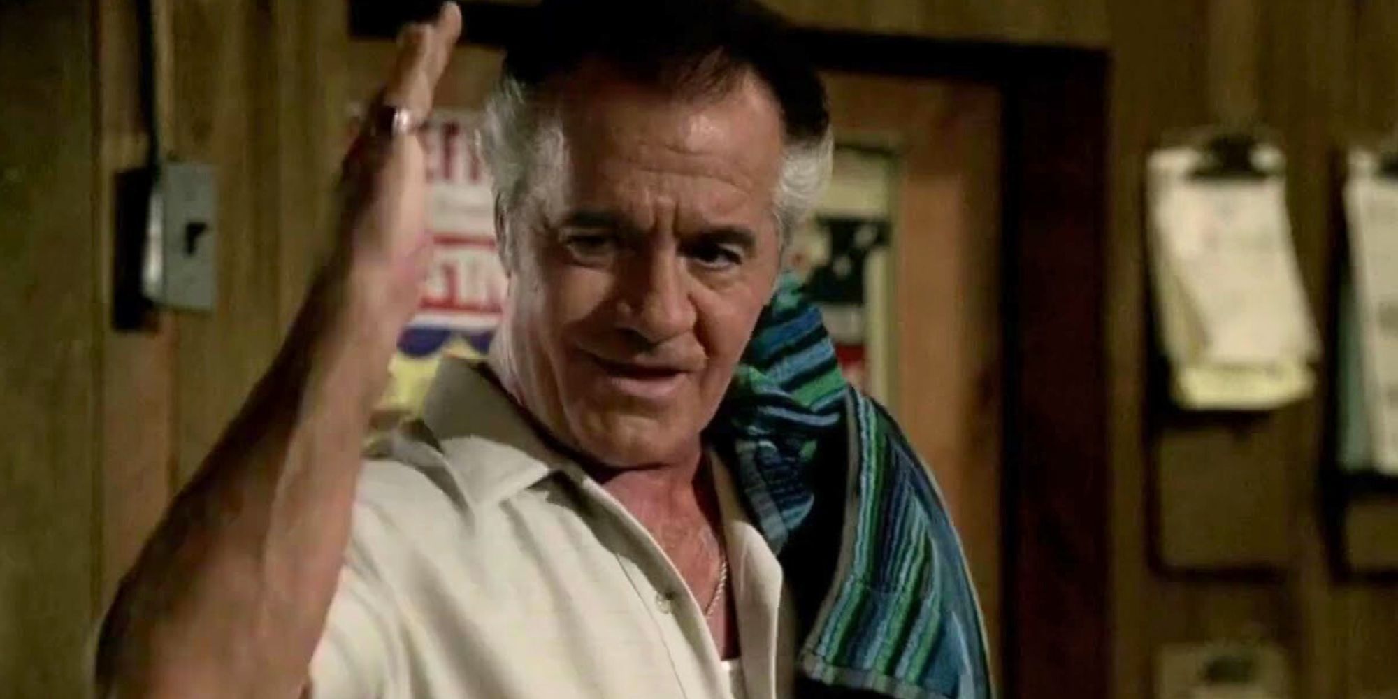 Tony Sirico as Paulie Walnuts throwing his hand in the air in The Sopranos