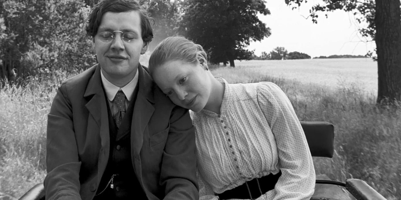 Leonie Benesch as Eva leaning on Christian Friedel as the Teacher during a carriage ride in The White Ribbon