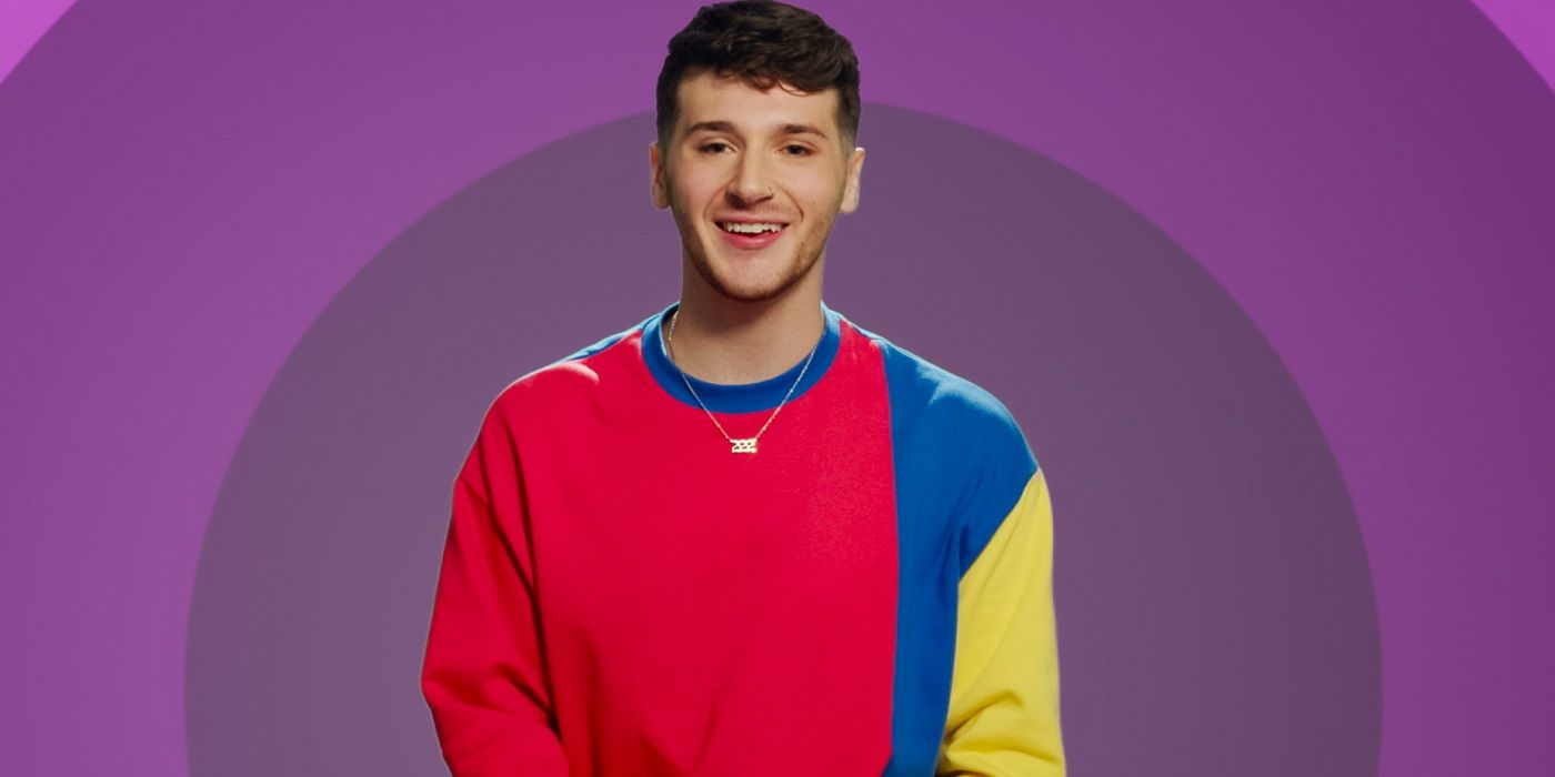 The Circle Season 6 contestant Jordan, who wears a red, blue, and yellow crewneck sweater