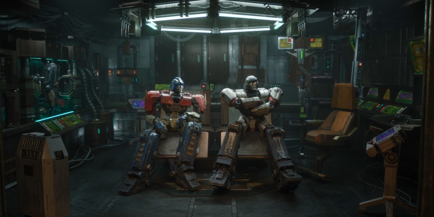 Orion Pax, voiced by Chris Hemsworth, and D-16, voiced by Brian Tyree Henry, sitting next to one another.