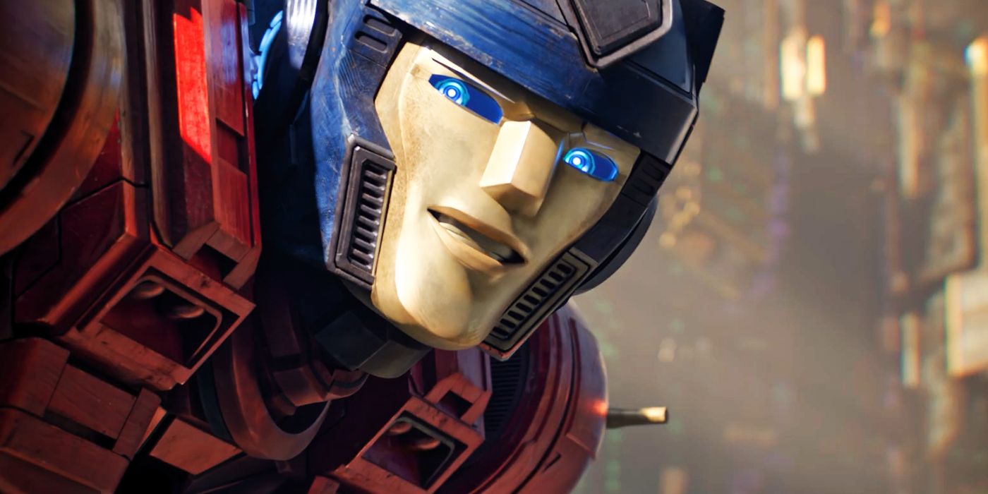 A close-up of Orion Pax smiling in Transformers One before he becomes Optimus Prime