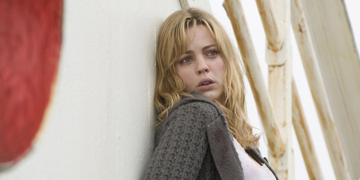 Melissa George looking frightened while leaning on a ship wall in Triangle