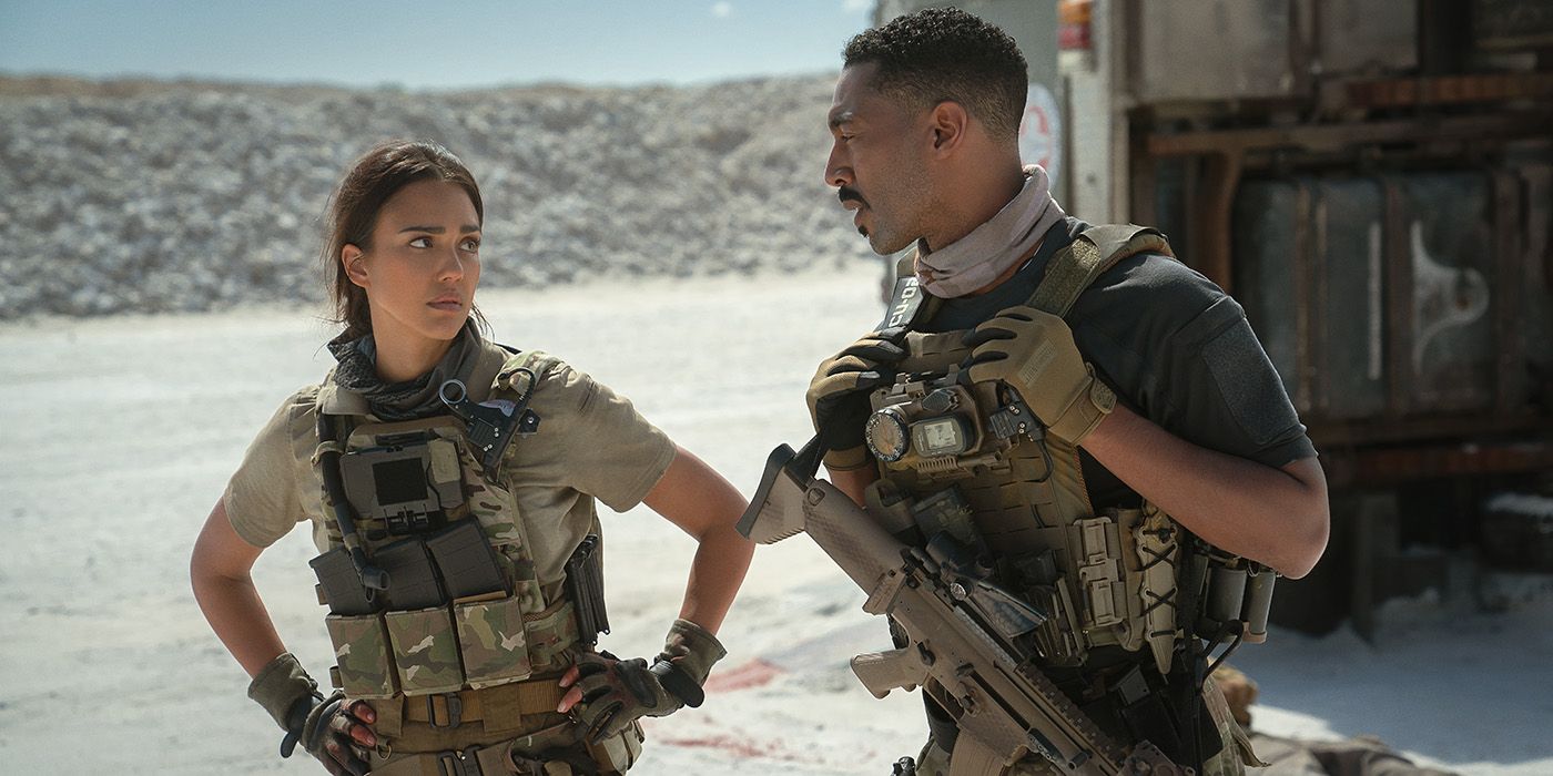 Jessica Alba talking to a man while both wearing combat gear in Trigger Warning