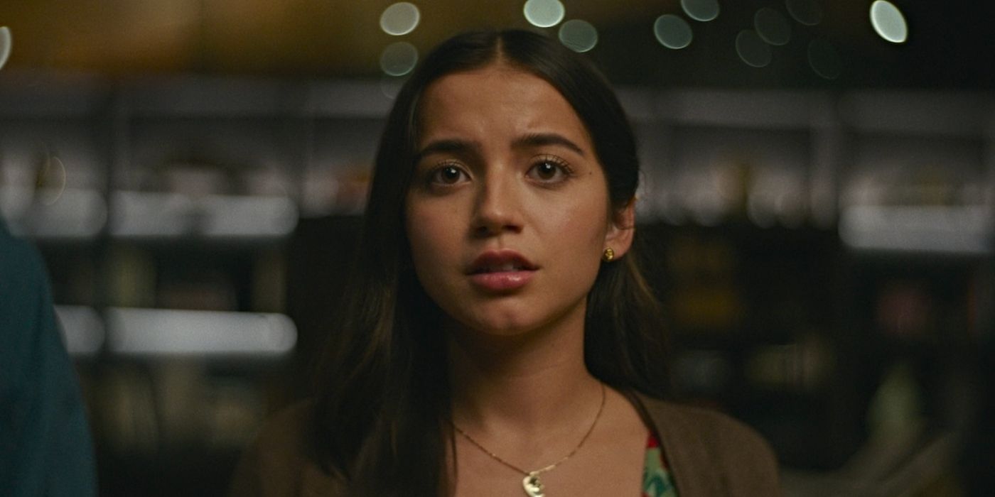 Isabela Merced as Aza Holmes, looking intensely towards the camera at a painting in Turtles All the Way Down