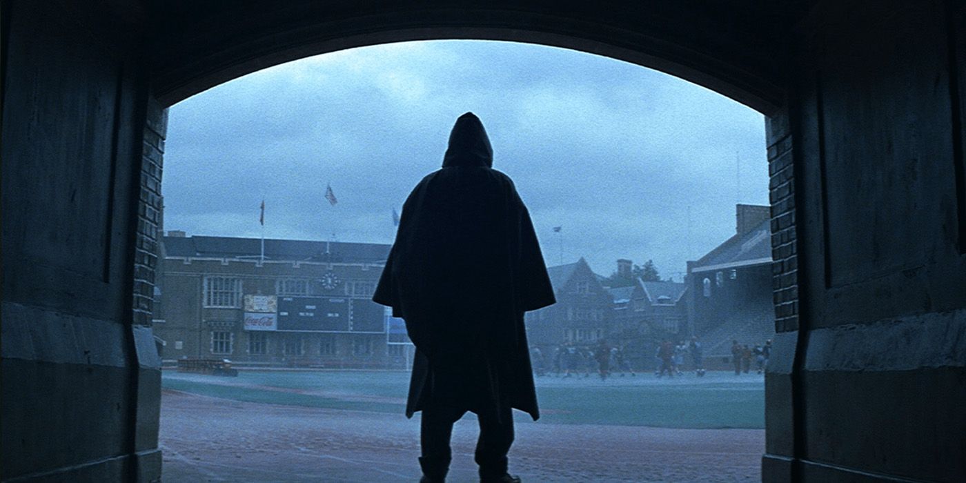 David Dunn (Bruce Willis) stands in the rainy ballpark in 'Unbreakable'