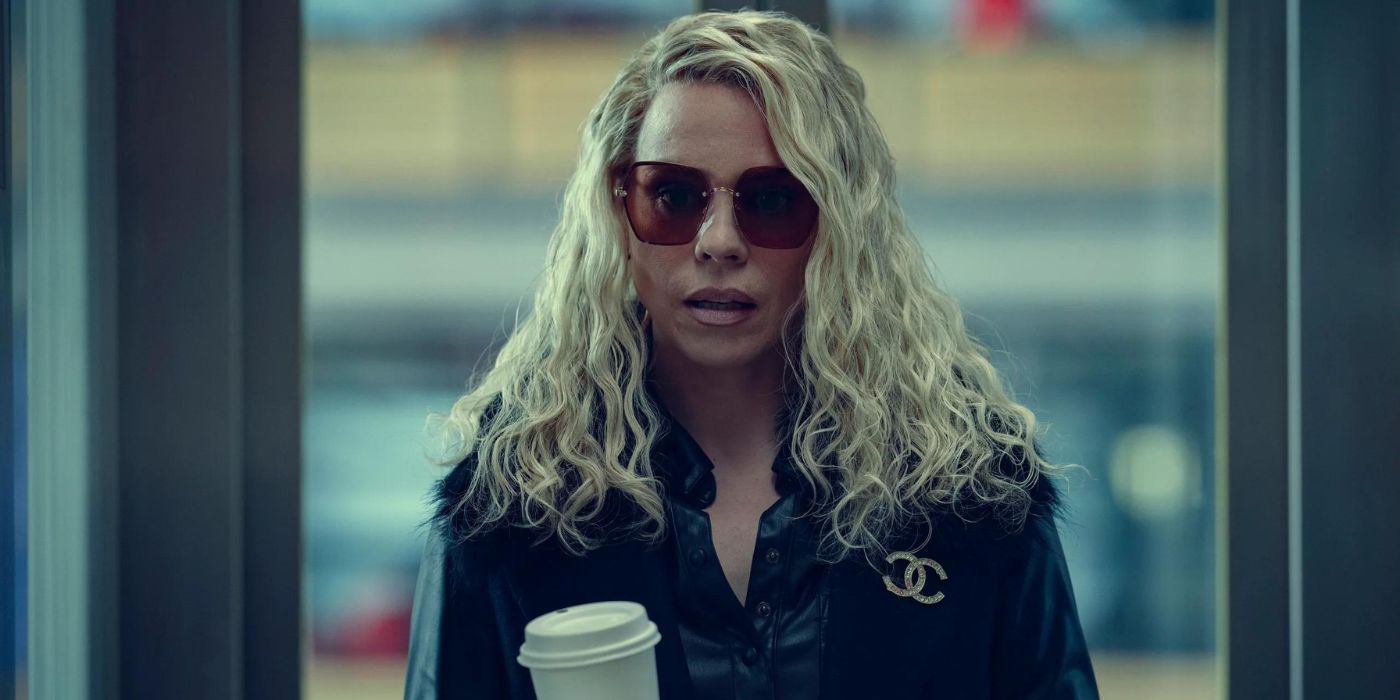 Billie Piper as Sam McAlister in Scoop wearing sunglasses and holding a coffee cup