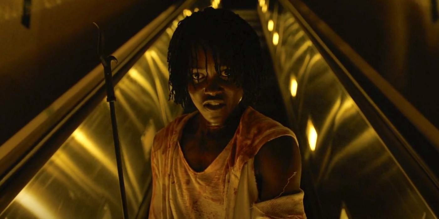 Lupita Nyong'o descends to the underground tunnels in Us (2019).