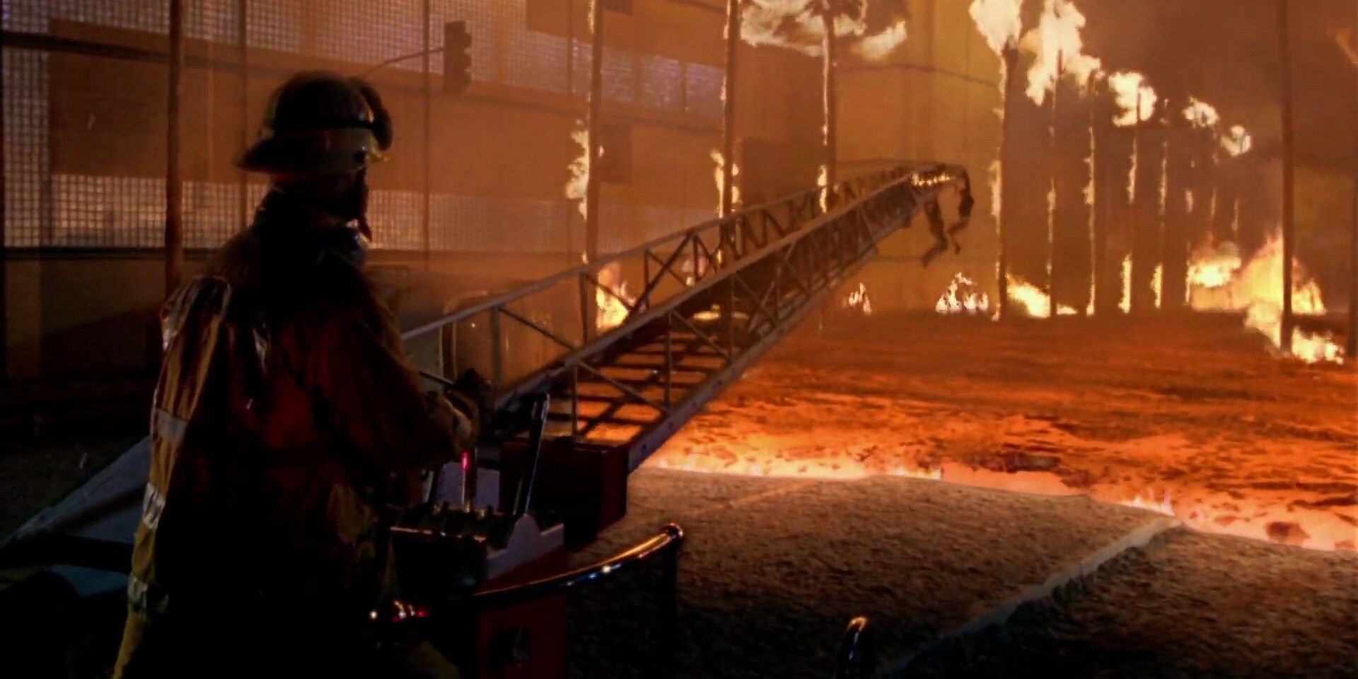 A fireman looking at a half melted crane and a large body of lava in Volcano (1997)