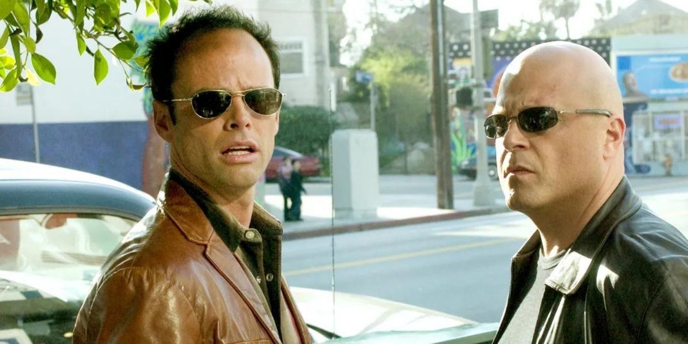 Walter Goggins and Michael Chiklis looking at someone off screen in The Shield