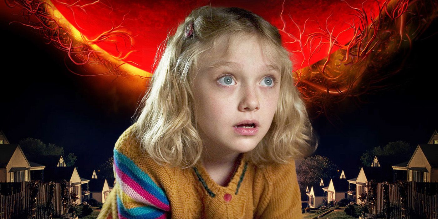 Dakota Fanning from War of the Worlds in front of a veiny red sky and houses