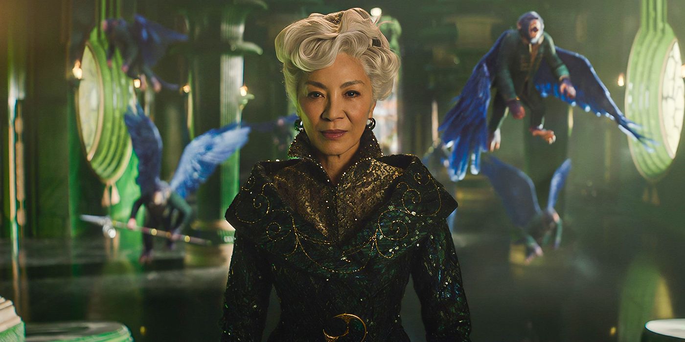 Michelle Yeoh as Madame Morrible surrounded by flying monkeys in Wicked.