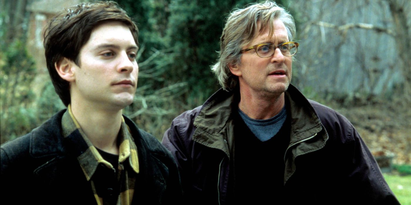 Michael Douglas and Tobey Maguire looking at someone off camera in Wonder Boys