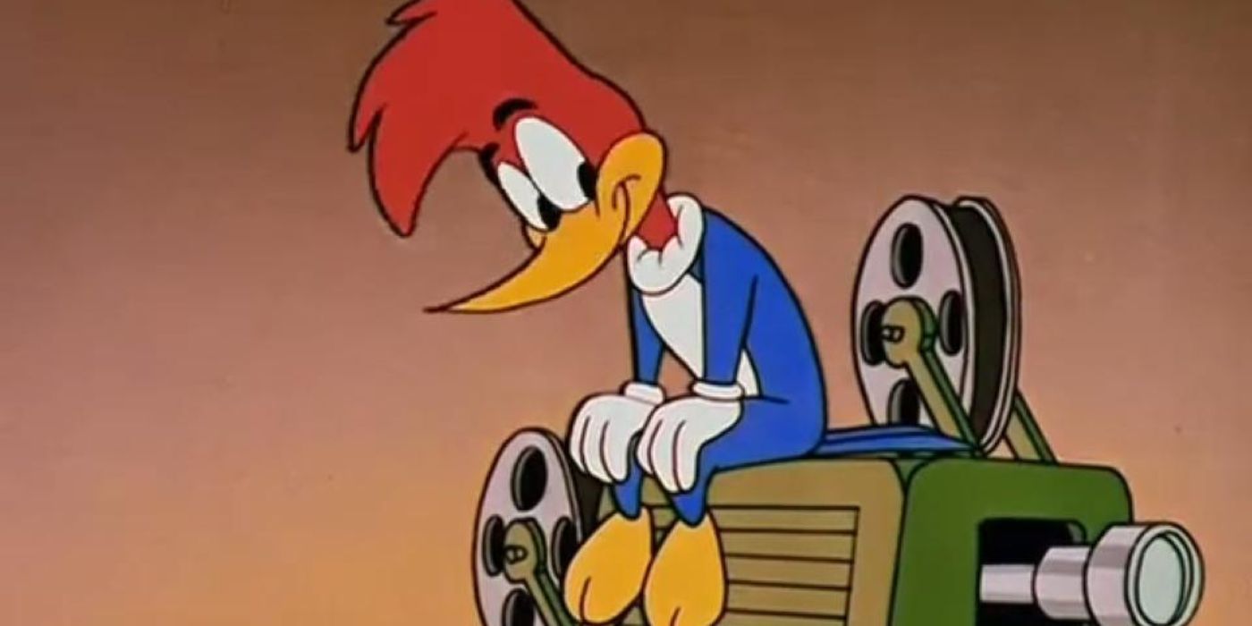 Woody Woodpecker sitting atop a movie projector