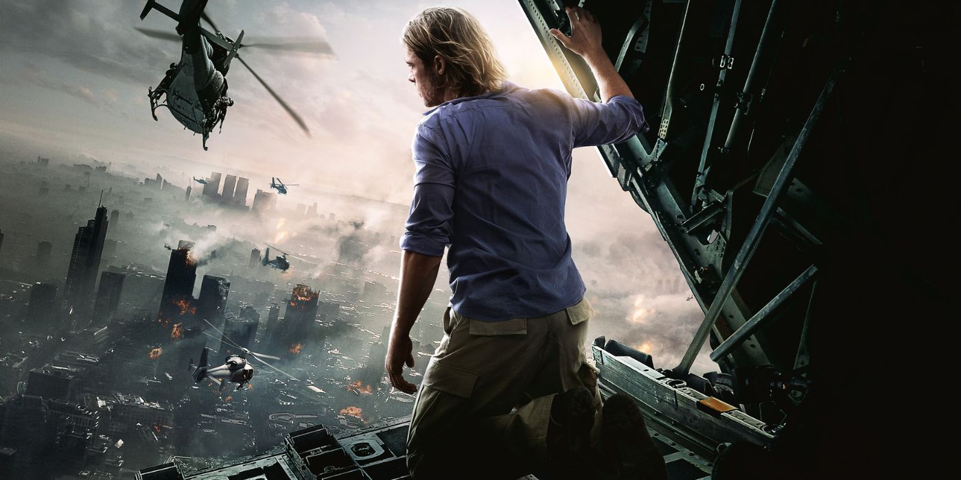 Brad Pitt sits in the open cargo bay doors of a plane, watching the devastation of a city below