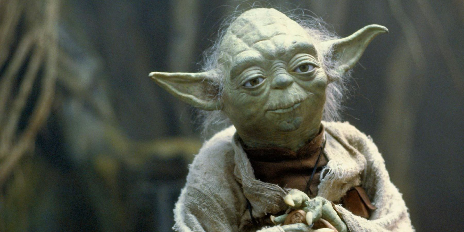 The wise Master Yoda, played by puppeteer Frank Oz, sits in the swamp of Dagobah in 'Star Wars: The Empire Strikes Back'