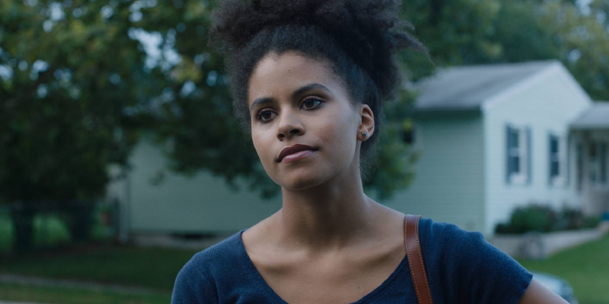 Zazie Beetz looking at someone off-camera in Sollers Point.