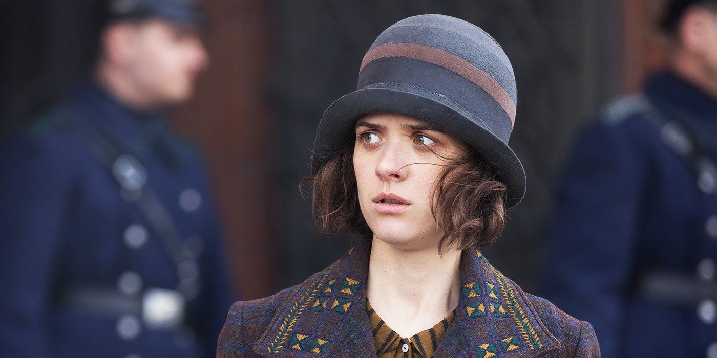 a girl looking perplexed and wearing a hat in Babylon Berlin