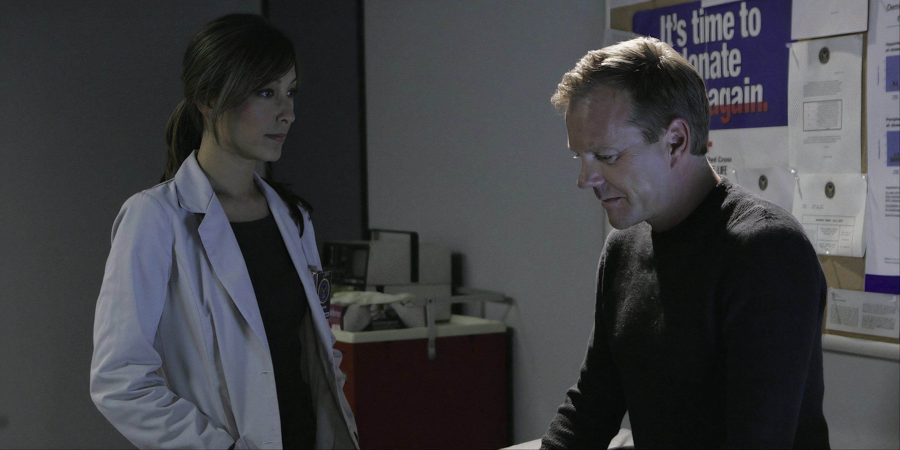 A doctor and Keifer Sutherland in a dim lit doctors office in 24