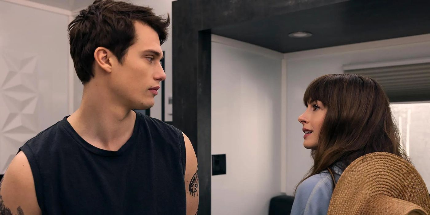 Anne Hathaway as Solene and Nicholas Galitzine as Hayes looking at each other in The Idea of You