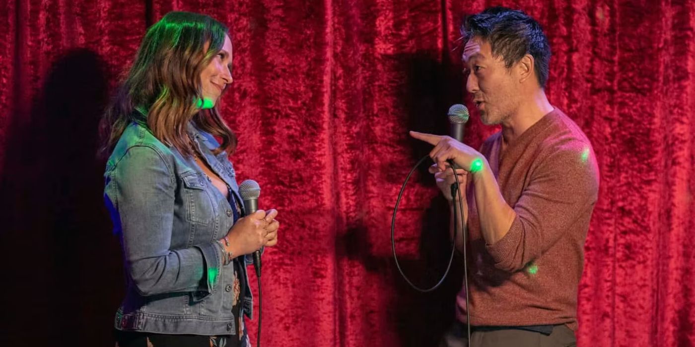 Maddie and Chimney singing karaoke in front of a red backdrop in &lsquo;9-1-1.'