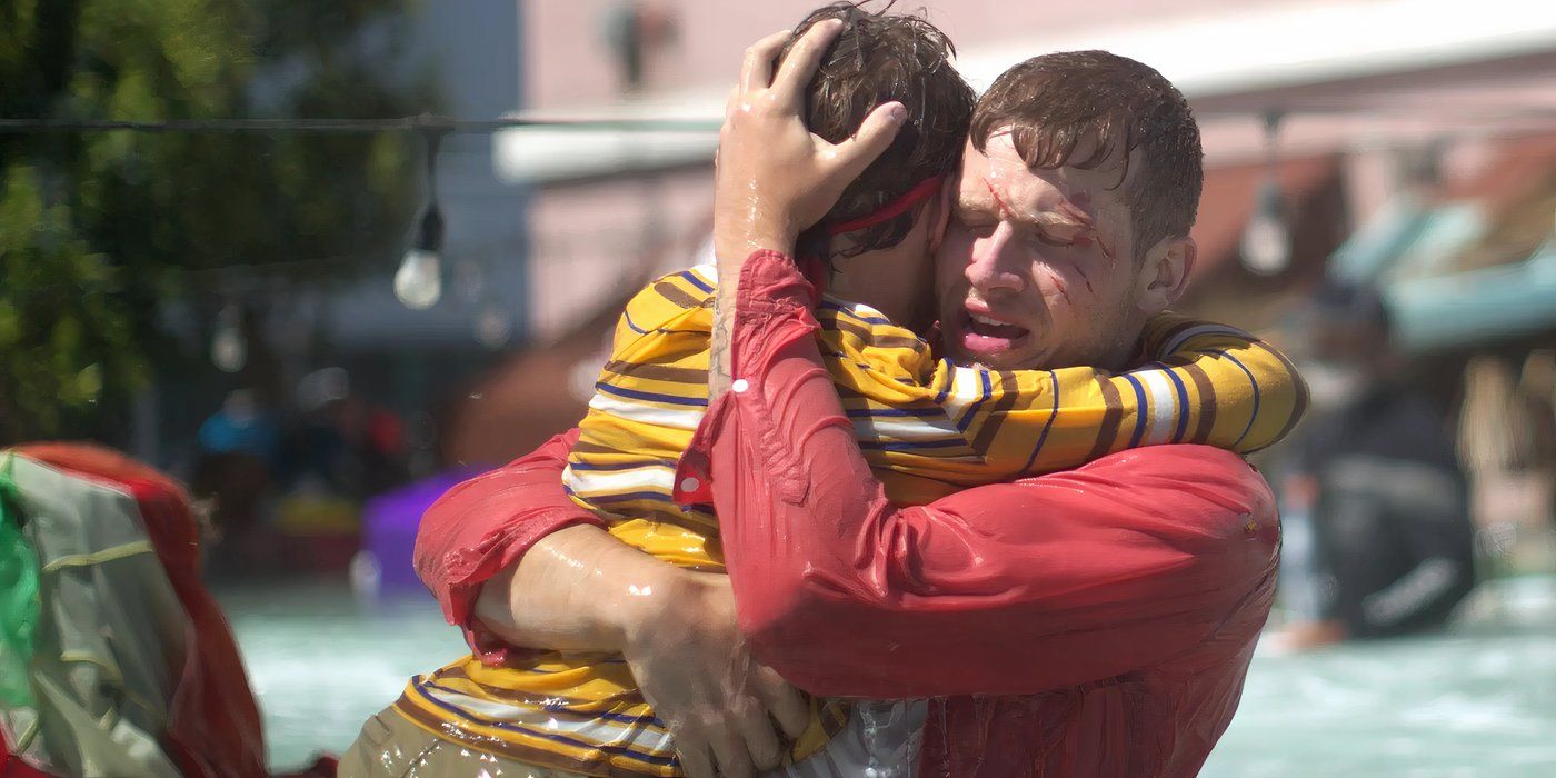 Buck holds Christoper while standing in waist-high water in the tsunami episode of '9-1-1.'