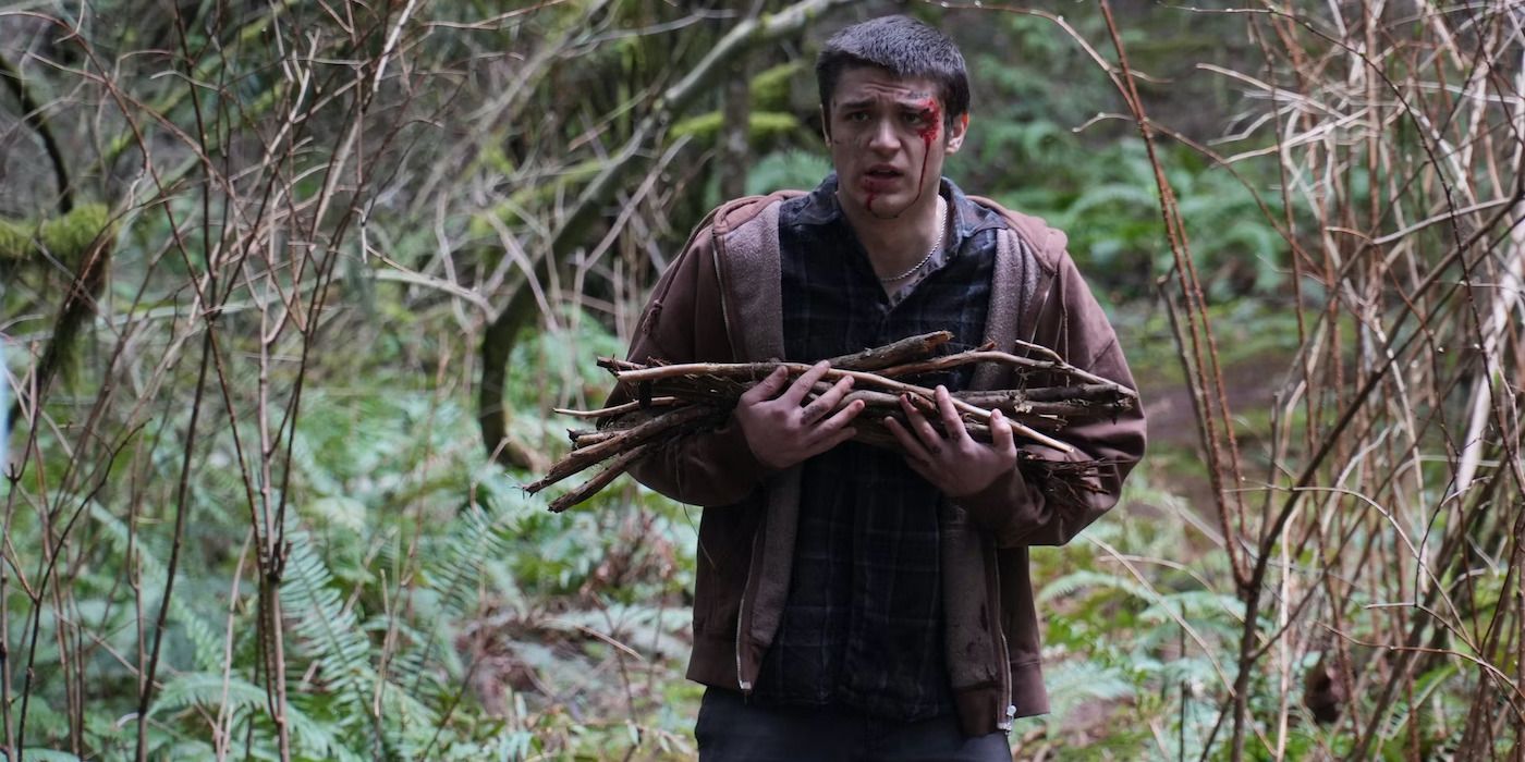 A bloody man walks with sticks in the woods in the movie Lazareth. 