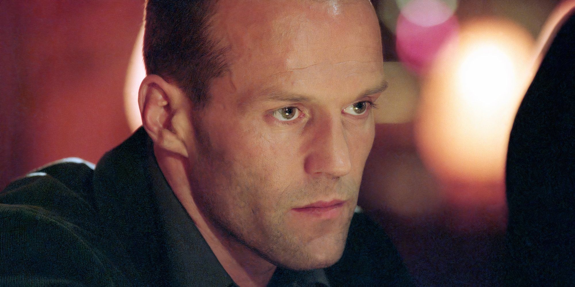 A close-up shot of Jason Statham looks serious as Frank Martin in The Transporter.