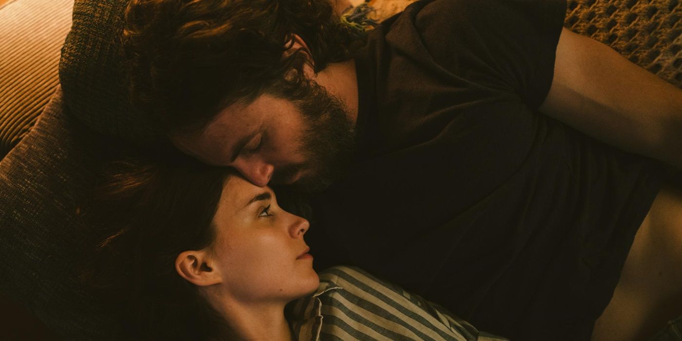 Rooney Mara as M lying down beside Casey Affleck as C in A Ghost Story