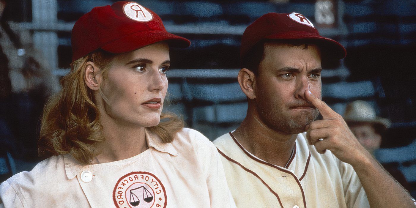 Geena Davis in a baseball uniform, Tom Hanks beside her with his finger on his nose looking angry in A League of Their Own.