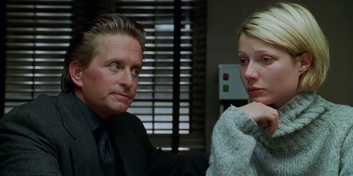 Michael Douglas as Steven and Gwyneth Paltrow as Emily sitting in a police station in A Perfect Murder