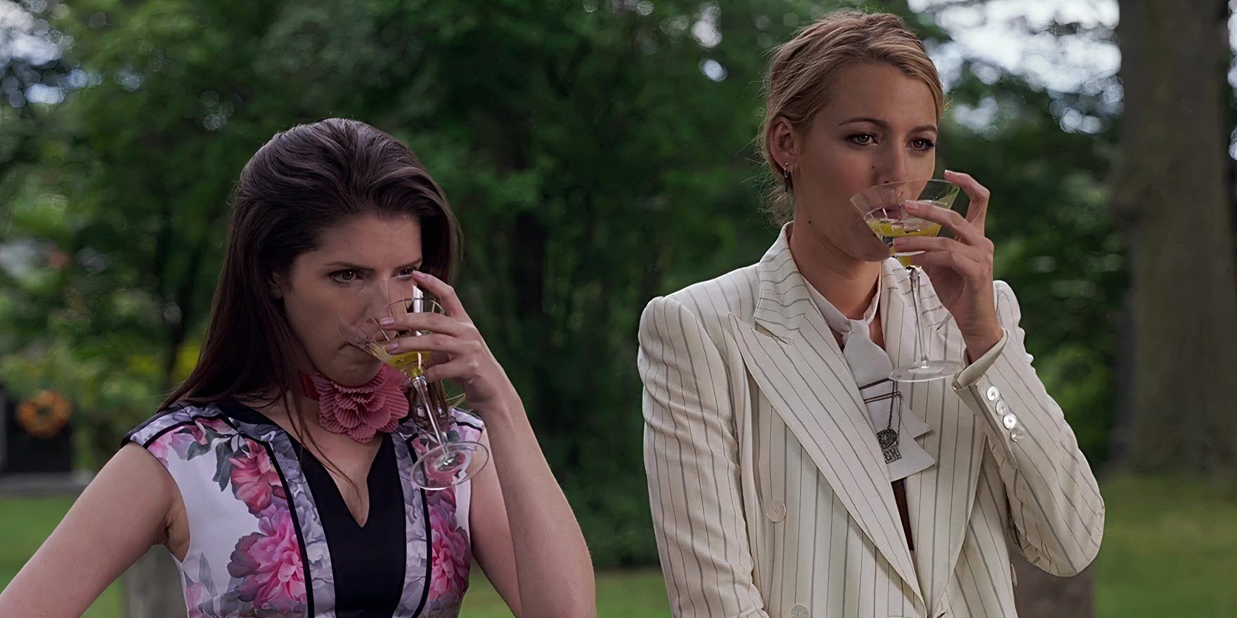 Anna Kendrick as Stephanie and Blake Lively as Emily drinking a martini in a scene from A Simple Favor