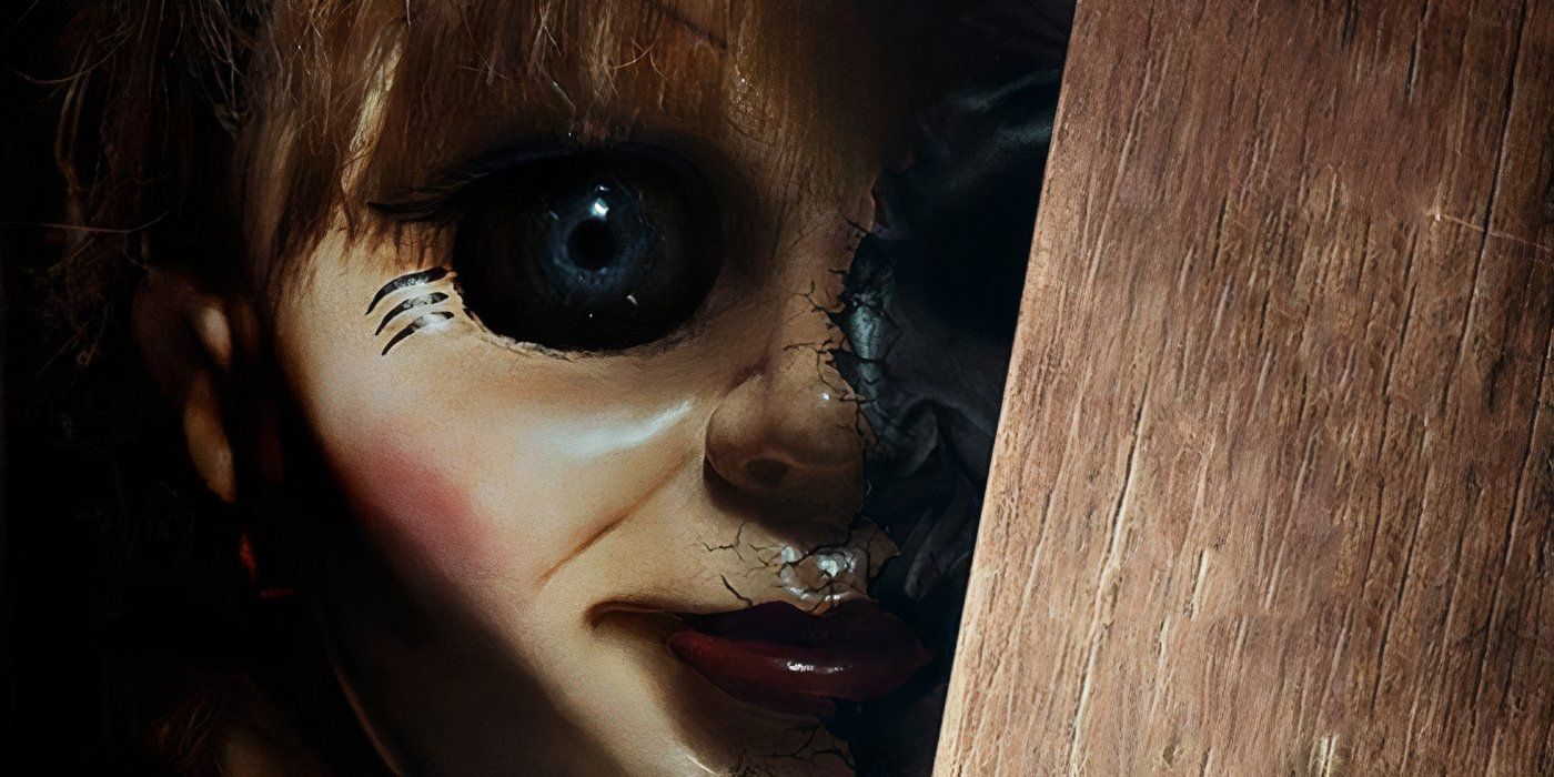 Promotional image for "Annabelle: Creation' featuring Annabelle hiding behind a wooden plank in the dark