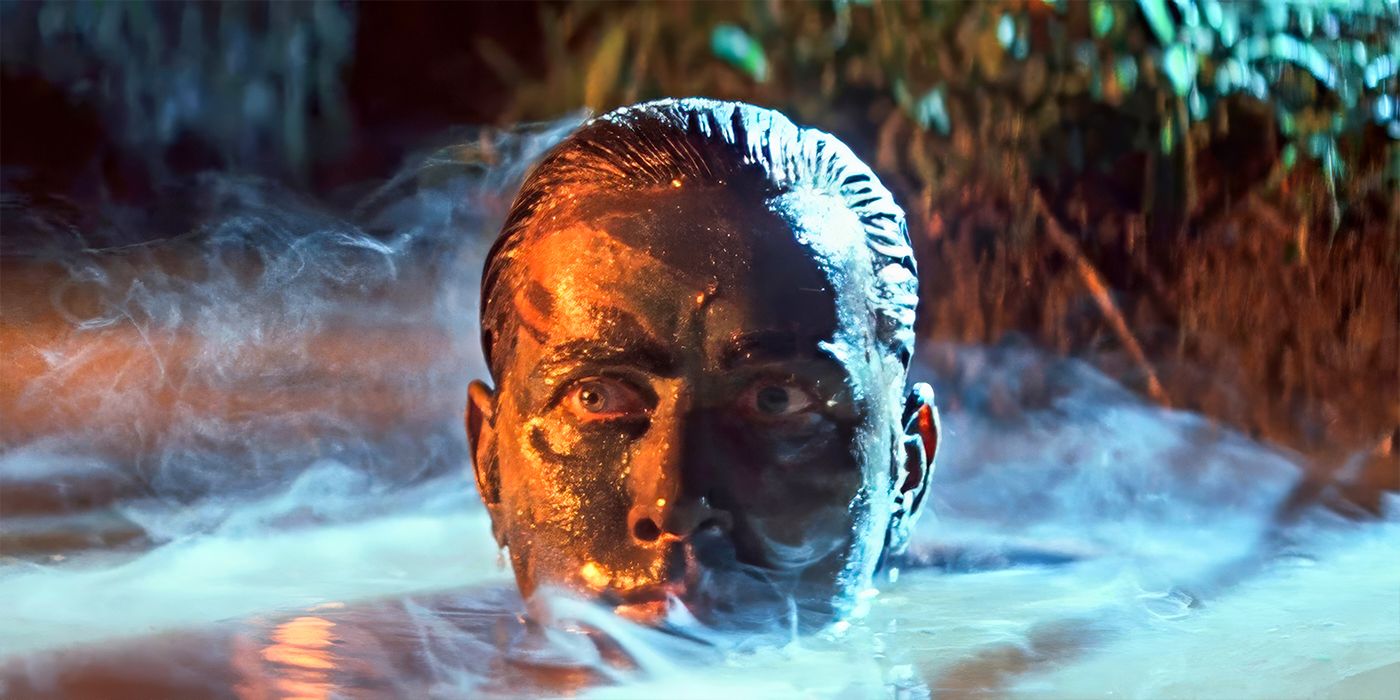 Martin Sheen as Capt. Benjamin L. Willard, with only his head sticking out of a pond with mud on his face in Apocalypse Now
