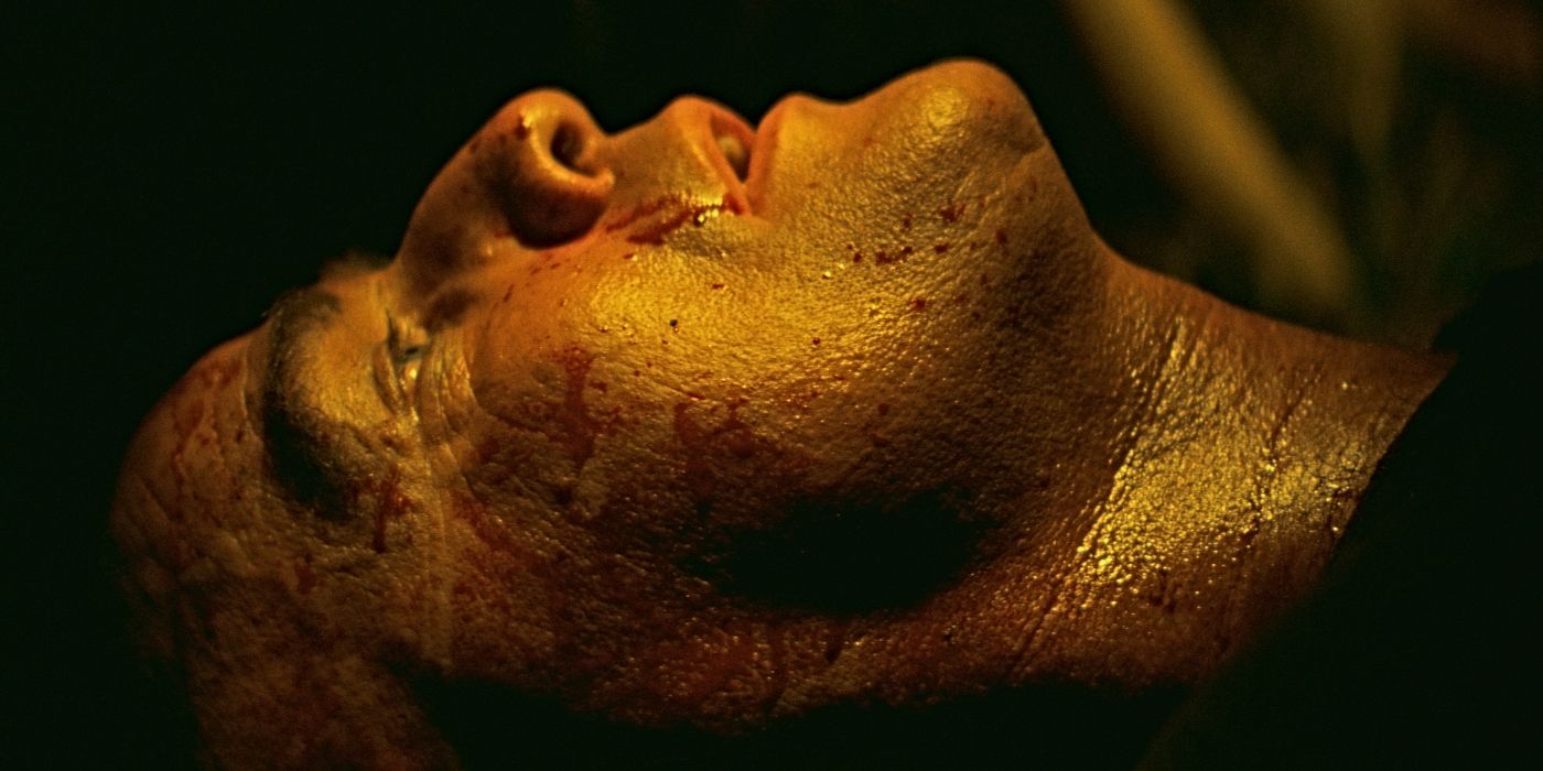 Close up of Marlon Brando's face as Col. Walter E. Kurtz, lying face up with blood on his face in Apocalypse Now