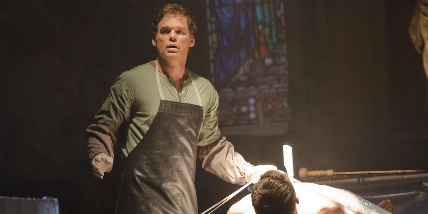 Dexter stands like a deer in the headlights holding a knife over a dead body