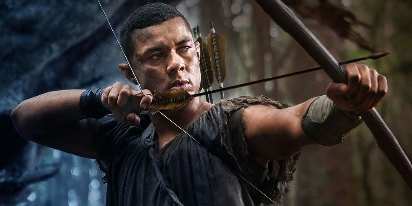 Arondir, played by Ismael Cruz Córdova, holding a bow and arrow in 'Lord of the Rings: Rings of Power.'